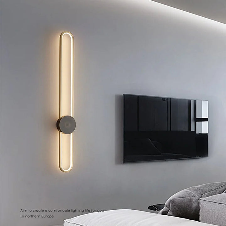 "modern led wall sconce mounted on white wall"