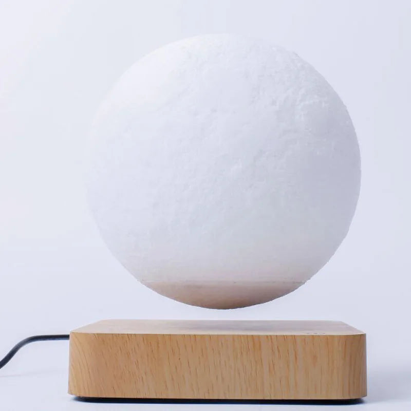 moon night light levitating on wooden base