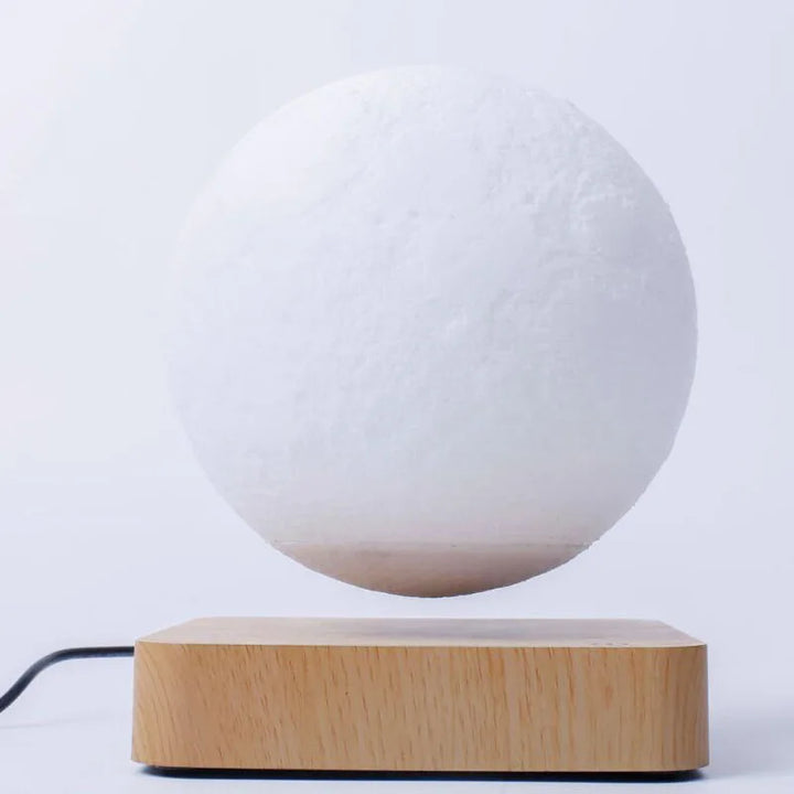 moon night light levitating on wooden base